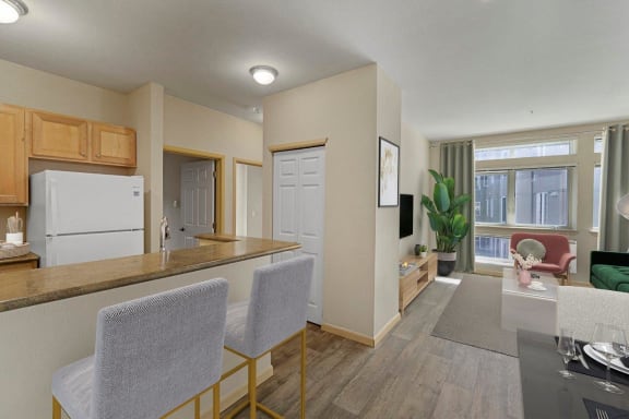 Met245 Apartments Model Kitchen and View into Living Room