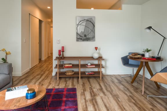 a living room with a couch and a table at Wilcox, Seattle