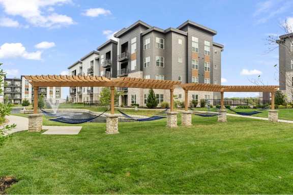 A large building with a playground in front of it.