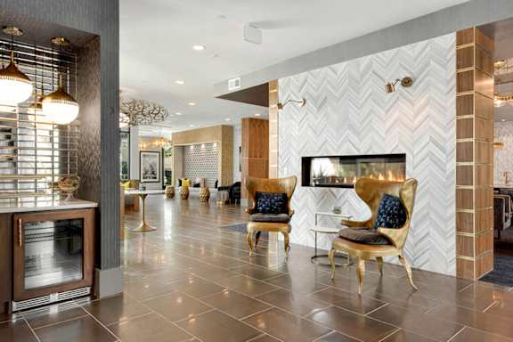 A modern living room with a fireplace and a TV.