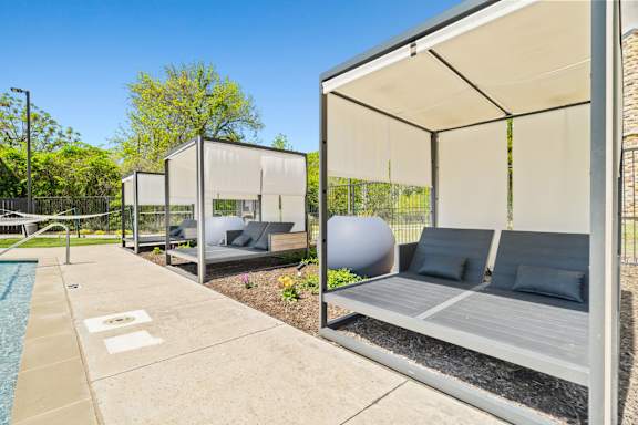 A modern outdoor seating area with a pool.