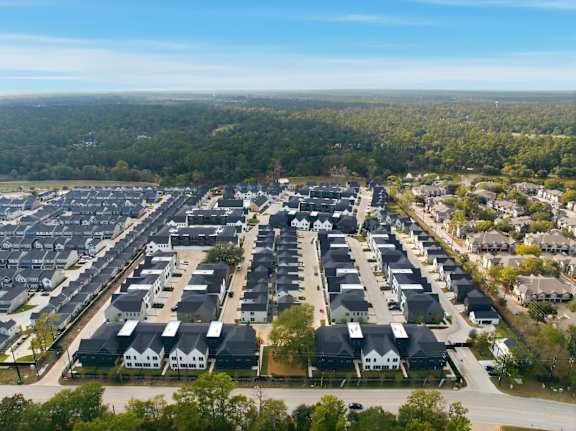 A bird's eye view of a residential area with houses and trees.