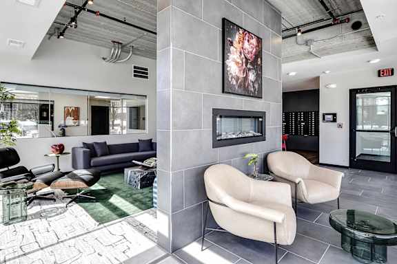 A modern waiting room with a grey and black color scheme.