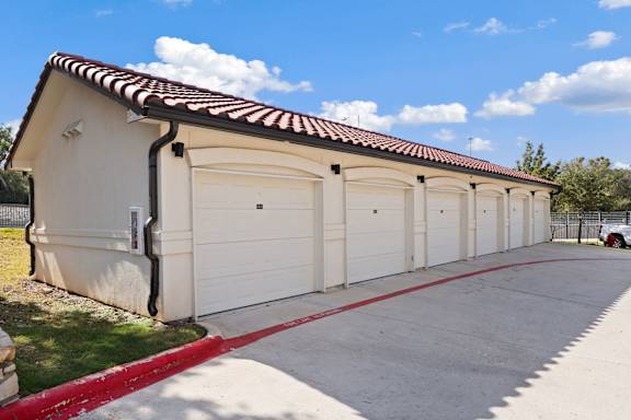 A long row of garage doors are closed.