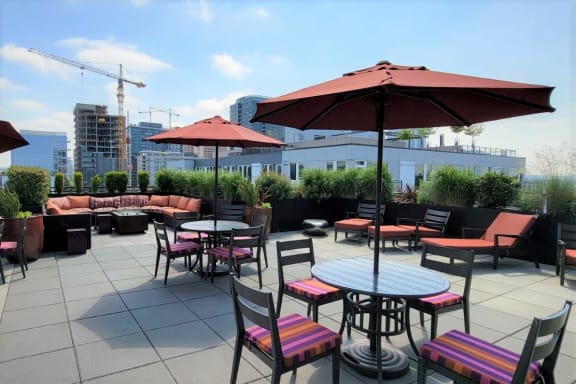 Lux Apartments Bellevue WA Rooftop deck with seating and views of downtown Bellevue