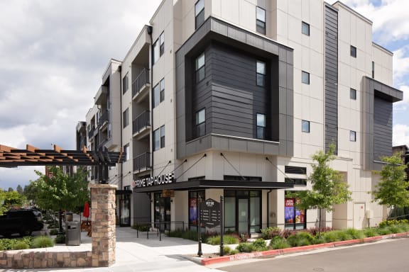 a rendering of the exterior of a building with a sign that reads pier house