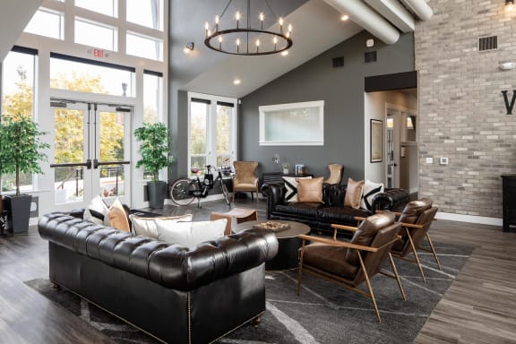 a living room filled with furniture and a large window