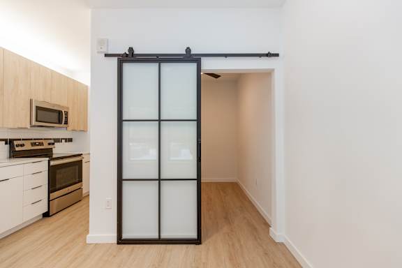 Spacious rooms with sliding glass door at Cannery Flats, Montana, 59715