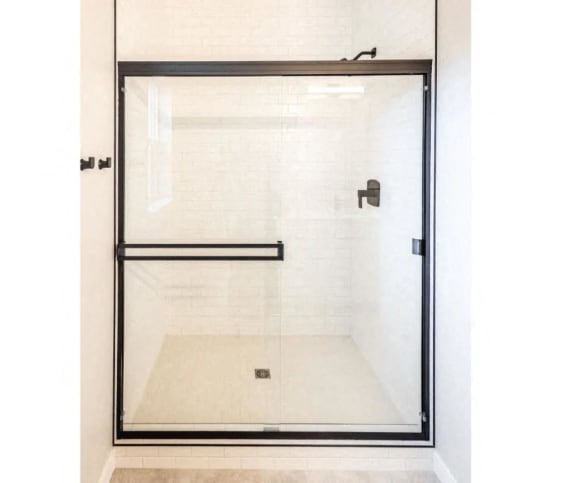 the master bathroom has a large shower with a glass door&#xA0;at Alpine Landing Townhomes, Garden City