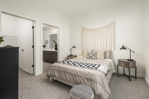 a bedroom with a large bed and a closet