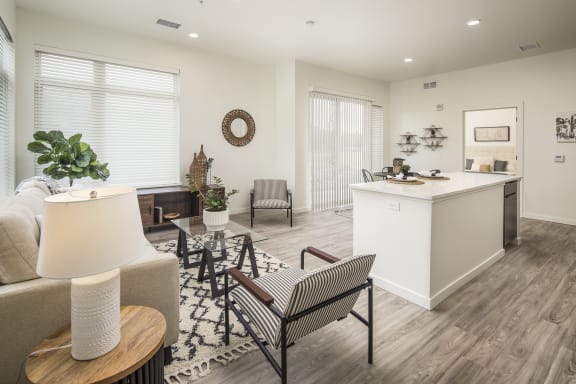 a living room with a kitchen and a dining room