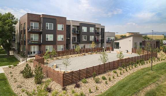 an aerial view of an apartment complex with a large patio and landscaping at Cycle Apartments, Colorado