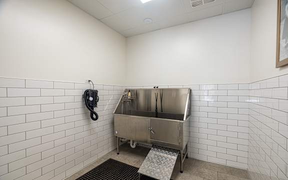a public restroom with a stainless steel sink and a telephone at Sylvan Uptown, Colorado, 80203