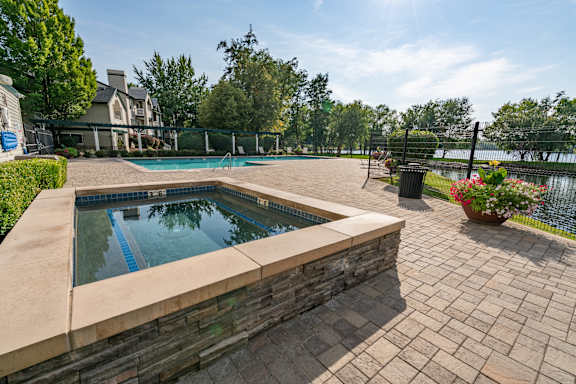 Pool area with spa and paver patio at Edgewater Apartments, Boise, ID