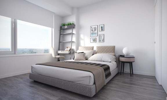 a bedroom with a bed and a window
