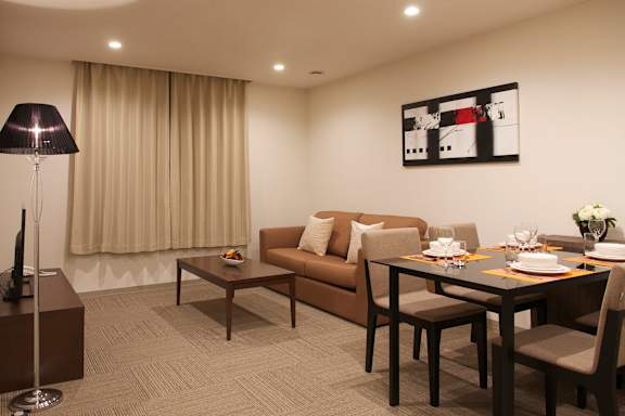 a living room with a couch and a table