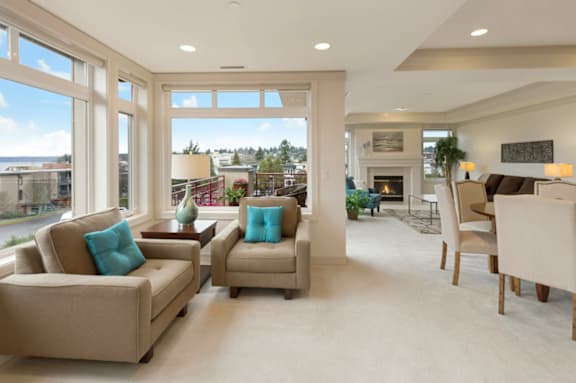 A living room with two couches and a fireplace.