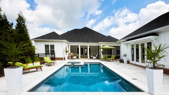 a house with a swimming pool in the backyard
