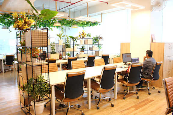 open concept community office space with hanging plants
