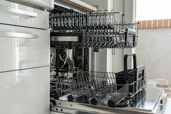 the inside of a dishwasher filled with wine glasses