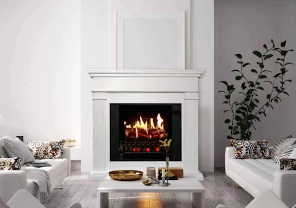 a living room with a fireplace and white furniture