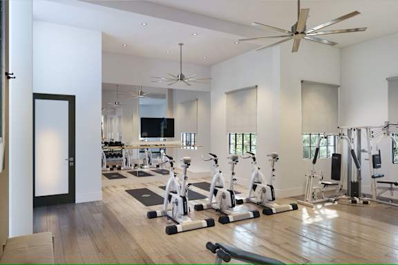 A spacious gym with a variety of exercise equipment.