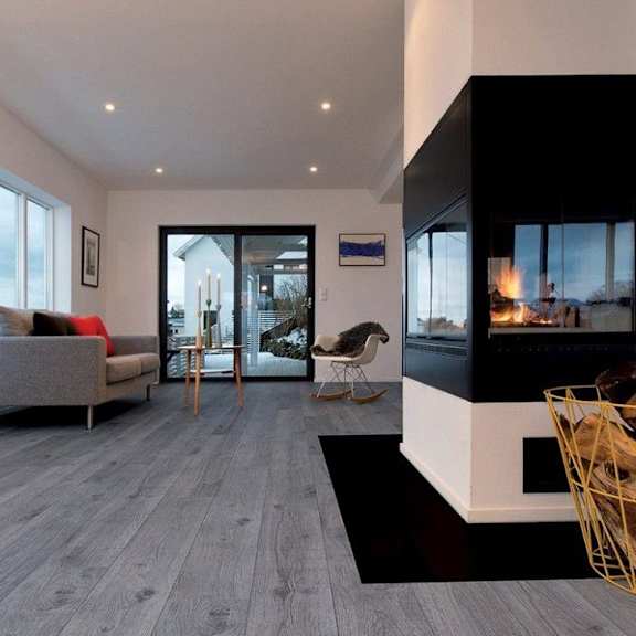 a living room with a fireplace and a sliding glass door