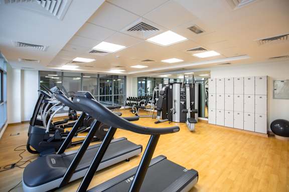 A gym with treadmills and exercise equipment.