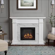 a living room with a fireplace and a painting on the wall