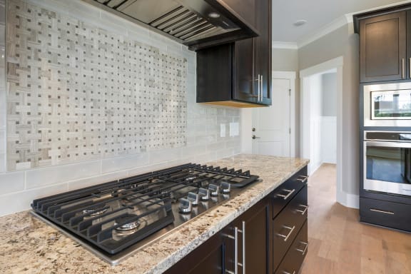 a kitchen with a stove and a counter top