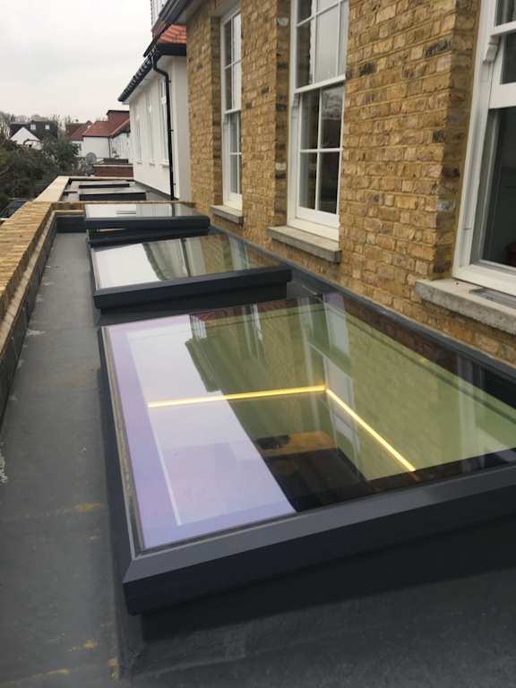 A long row of skylights on a building.