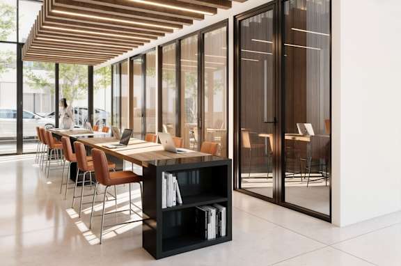 A conference room with a long table and chairs.