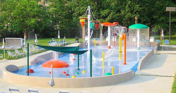 A water park with a large pool and water slides.