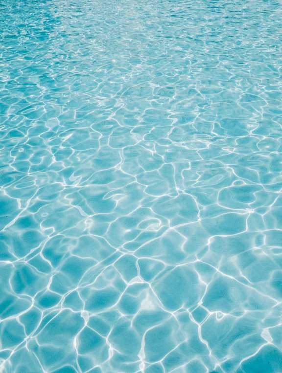 A close up of rippling water in a pool.