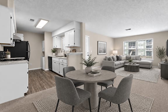A modern kitchen with a dining table and chairs in the foreground.