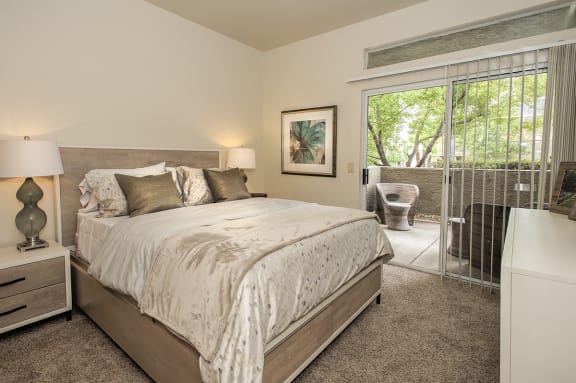 Model Bedroom With Access To Patio at Autumn Oaks Apartments, Roseville, CA, 95678