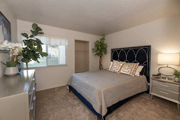 Model Silverleaf II primary bedroom at Autumn Oaks Apartments, Roseville, CA