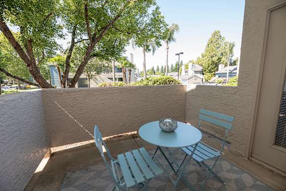 A patio with a table and two chairs at Autumn Oaks Apartments, Roseville, CA, 95678