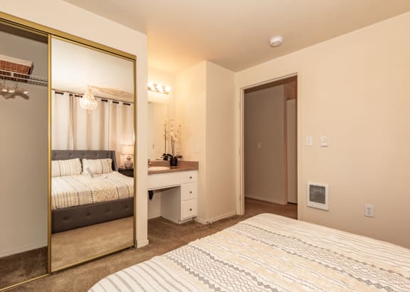 primary bedroom and vanity at Hathaway Court Apartments, OR 97070