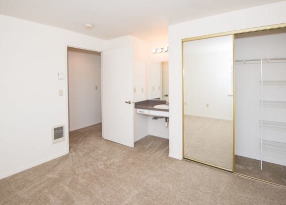 Upgraded Vacant Apartment Master Bedroom &amp; Vanity at St. Mary&#x27;s Woods Apartments, Beaverton, OR