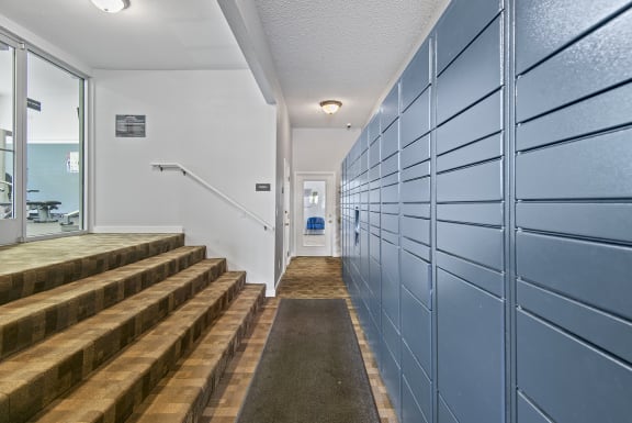 Self service package lockers and stairs to gym at Riverwood Apartments, Kent, Washington 98032