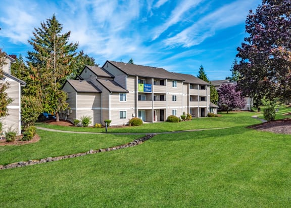 Sir Charles Court three story building exterior and green space, Beaverton, OR, 97006