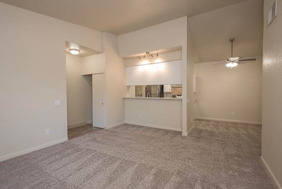 A spacious room with a carpeted floor at Sunset Summit, Rocklin, CA, 95765