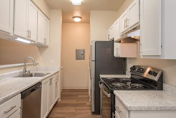A kitchen with a black refrigerator and stove at Sunset Summit, Rocklin, CA, 95765