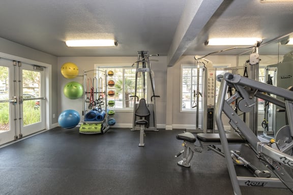 Fitness Center Equipment & Exit at Woodbridge Apartments, California, 95833