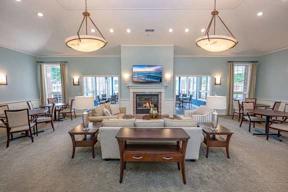 A living room with a fireplace and a television.