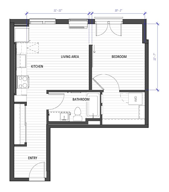 A floor plan of a house with a living area, kitchen, bedroom, bathroom, and entry.