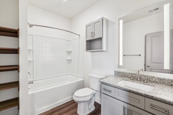 a bathroom with a sink toilet and a shower