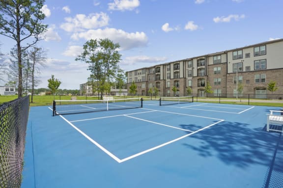 the preserve at ballantyne commons tennis courts with apartments in the background