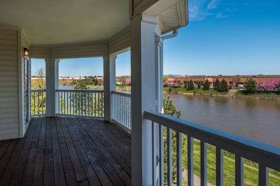 a balcony with a view of a river